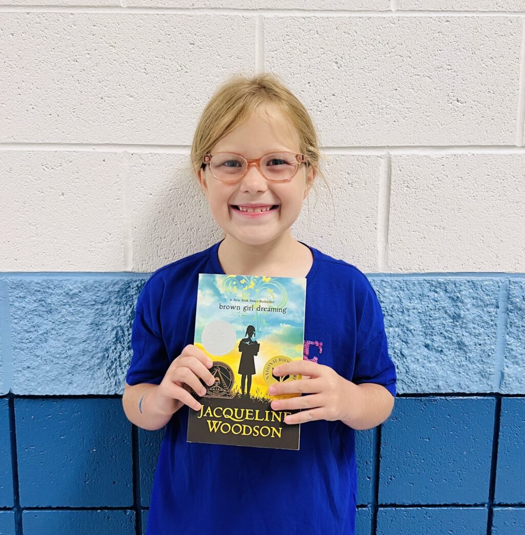 Praise Award Female Student in a Blue Shirt