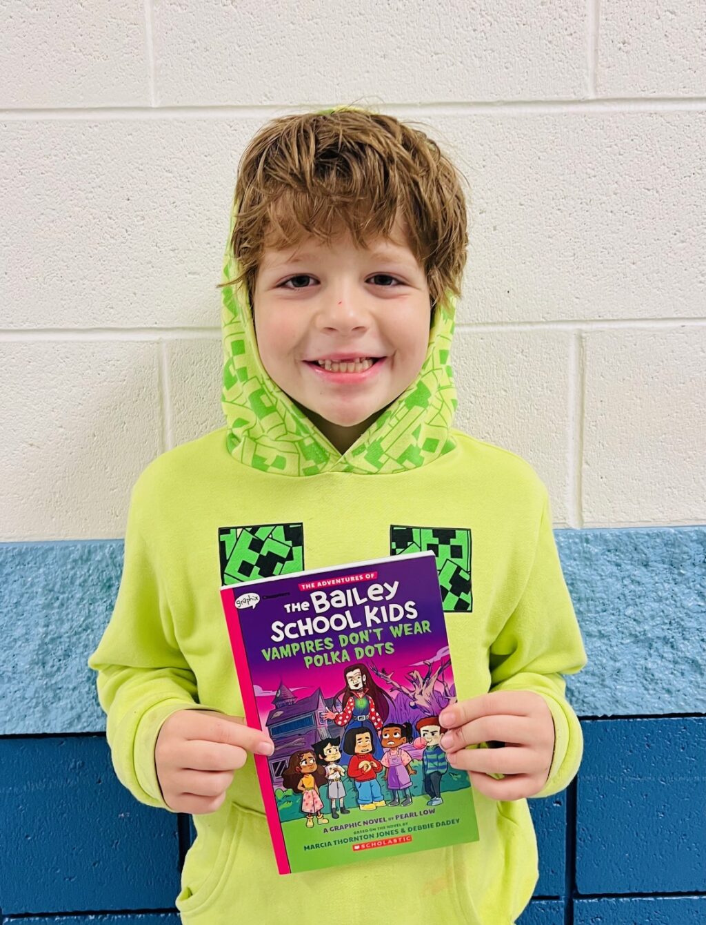 Image_student holding a book for earning an aviator or rise praise award