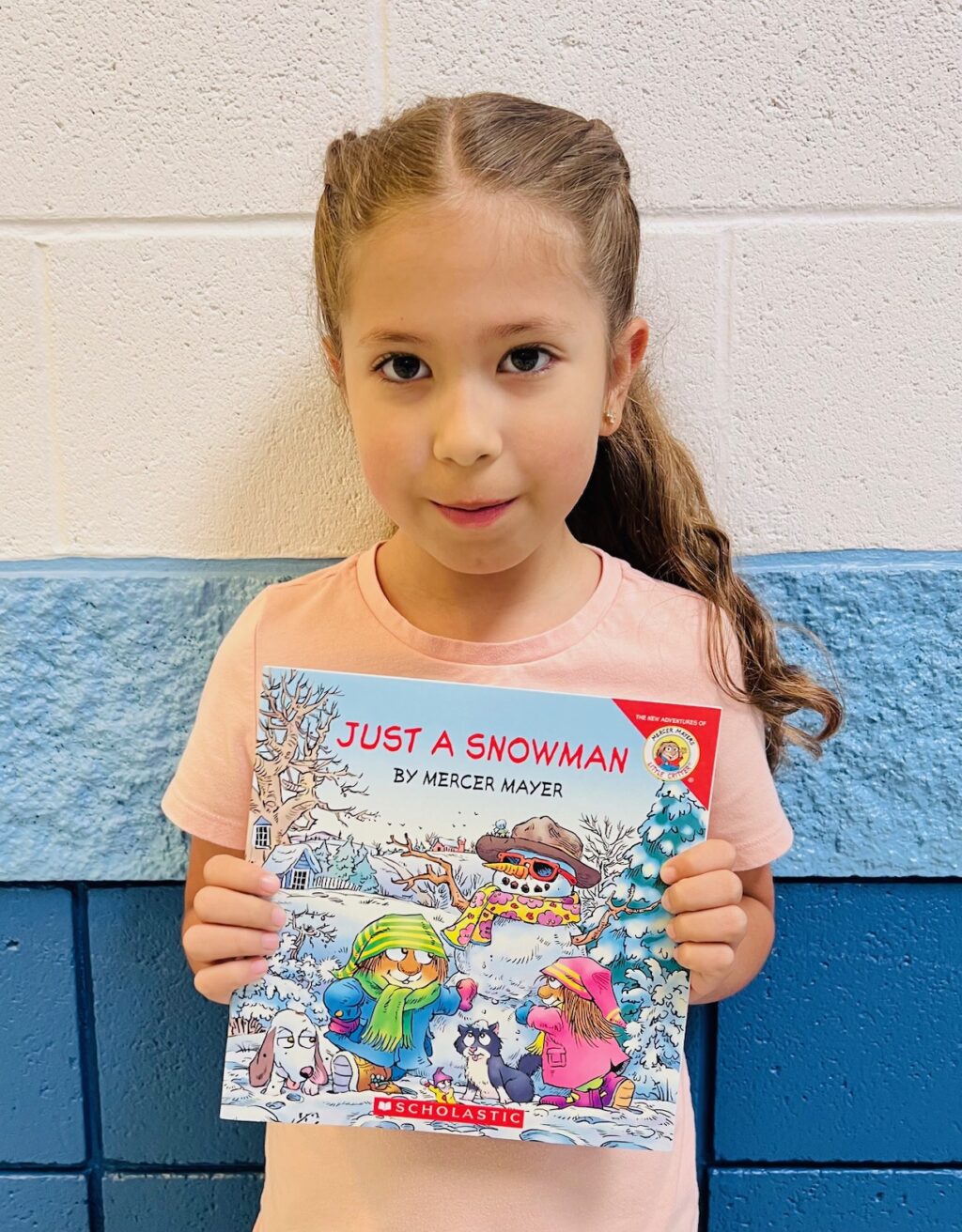 Image_student holding a book for earning an aviator or rise praise award