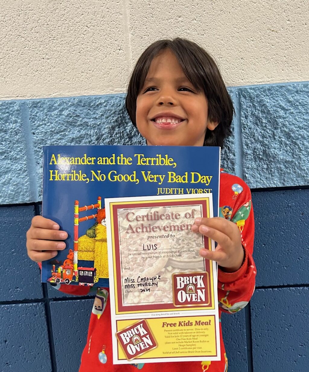 Image_student holding a book for earning an aviator or rise praise award