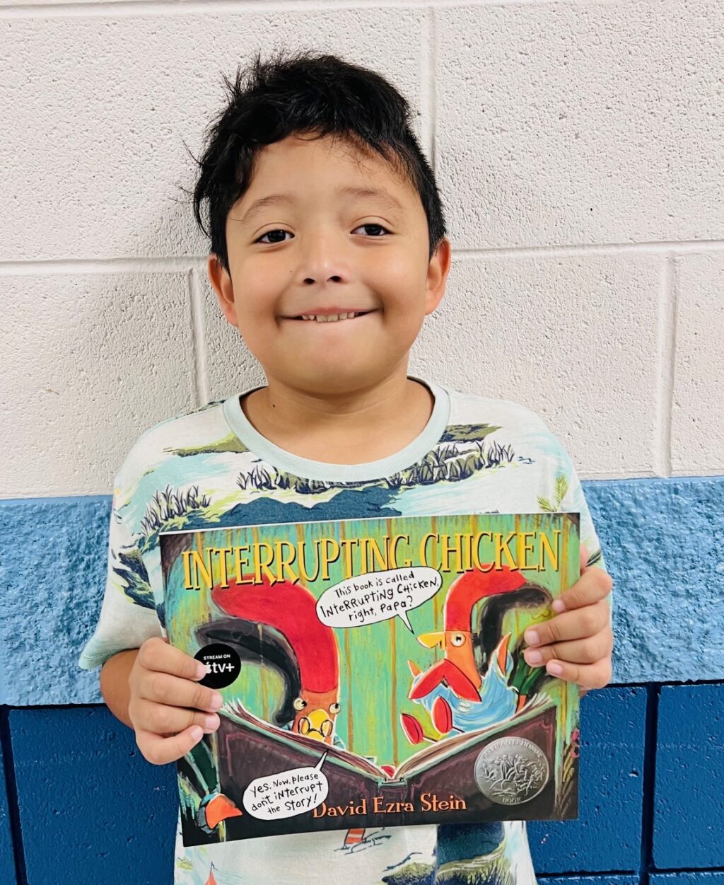 Image_student holding a book for earning an aviator or rise praise award