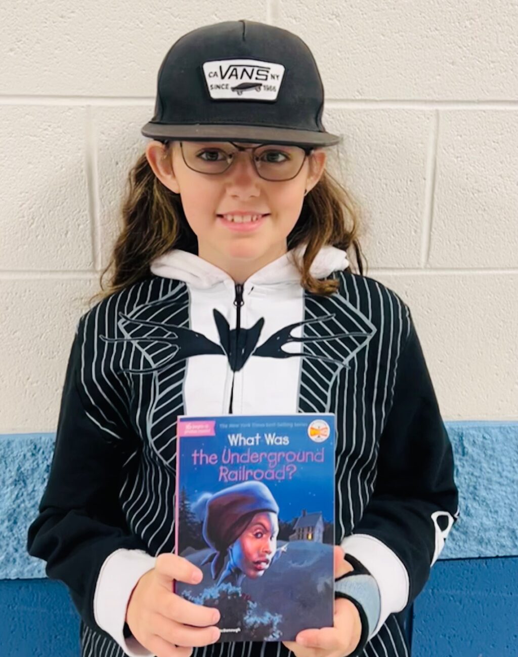 Image_student holding a book for earning an aviator or rise praise award