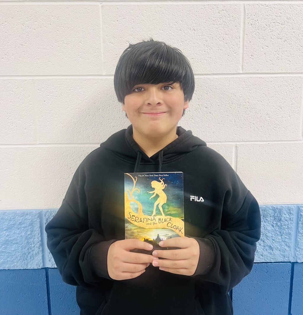 Student who received an Aviator or Rise Praise and was able to choose a book prize.