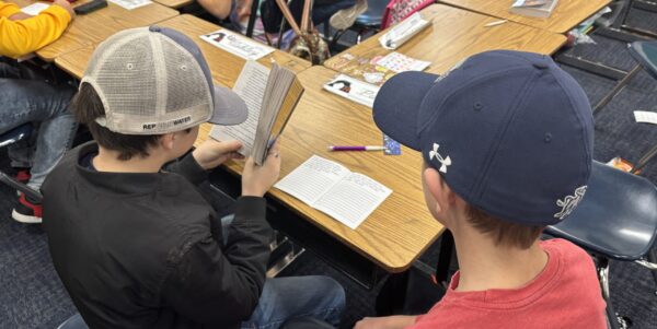 students involved in a reading challenge. Finding answers to answer questions about books they have read together.