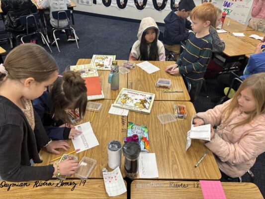 students involved in a reading challenge. Finding answers to answer questions about books they have read together.