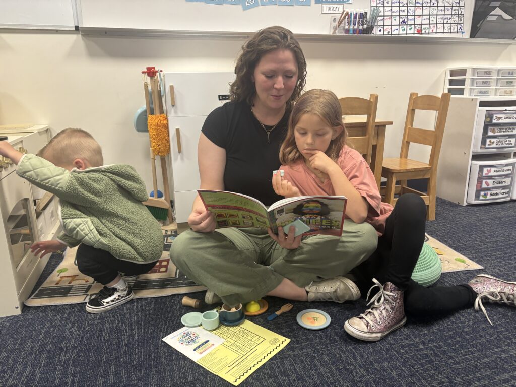 Students reading with  guests that could be parents, grandparents, family friends, or faculty and staff for read with a child day in May